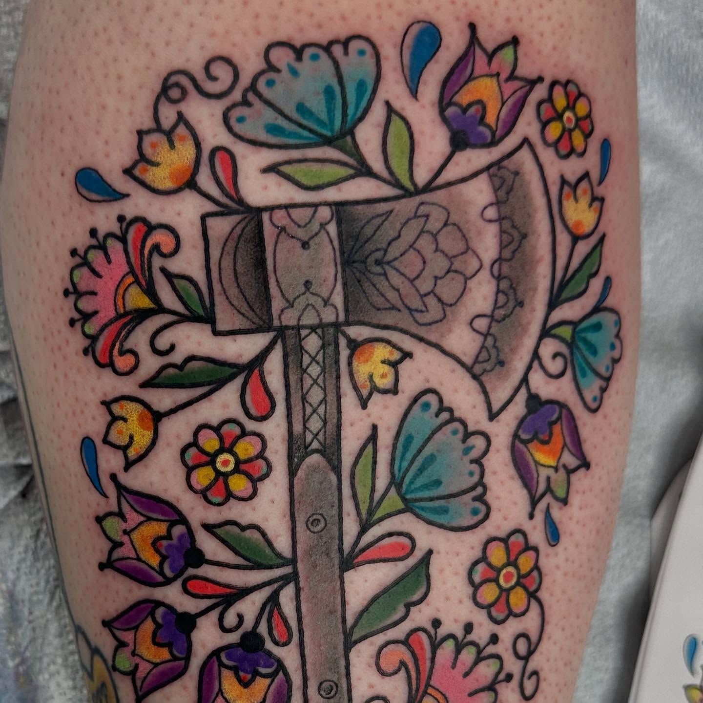 Cross and floral American traditional tattoo on the thigh by Andrea Lynne Hastings-Craven Tattoo Artist, Cleveland, Ohio