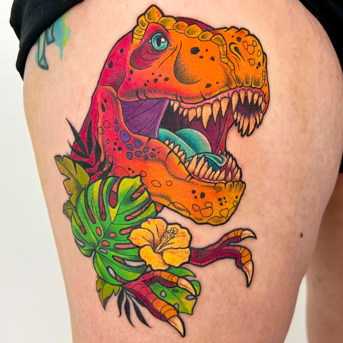 T-Rex and tropical foliage new school tattoo on the thigh by Fernanda Machado