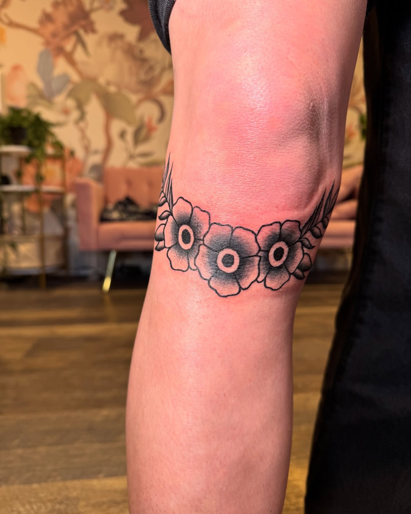Flowers black and grey tattoo on the forearm by Kinzi Brown