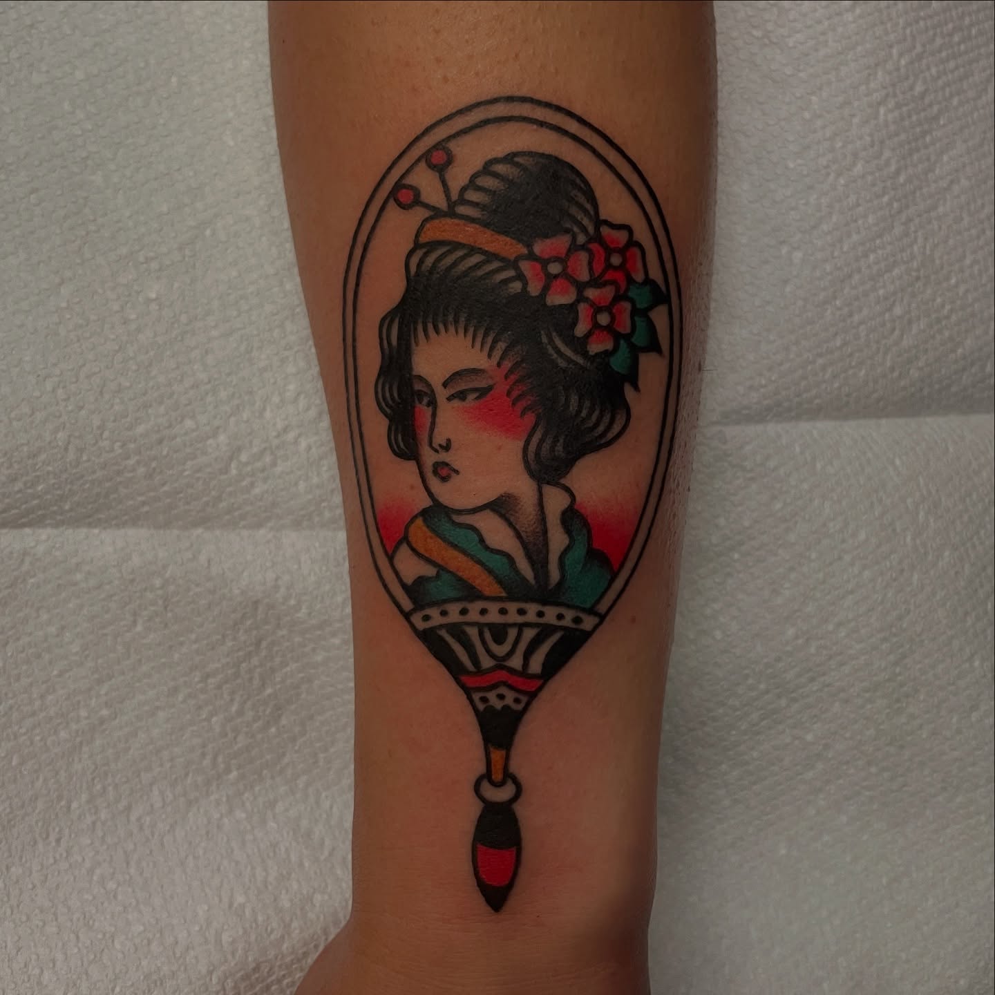 Geisha portrait American traditional tattoo on the forearm by Texas Jonah