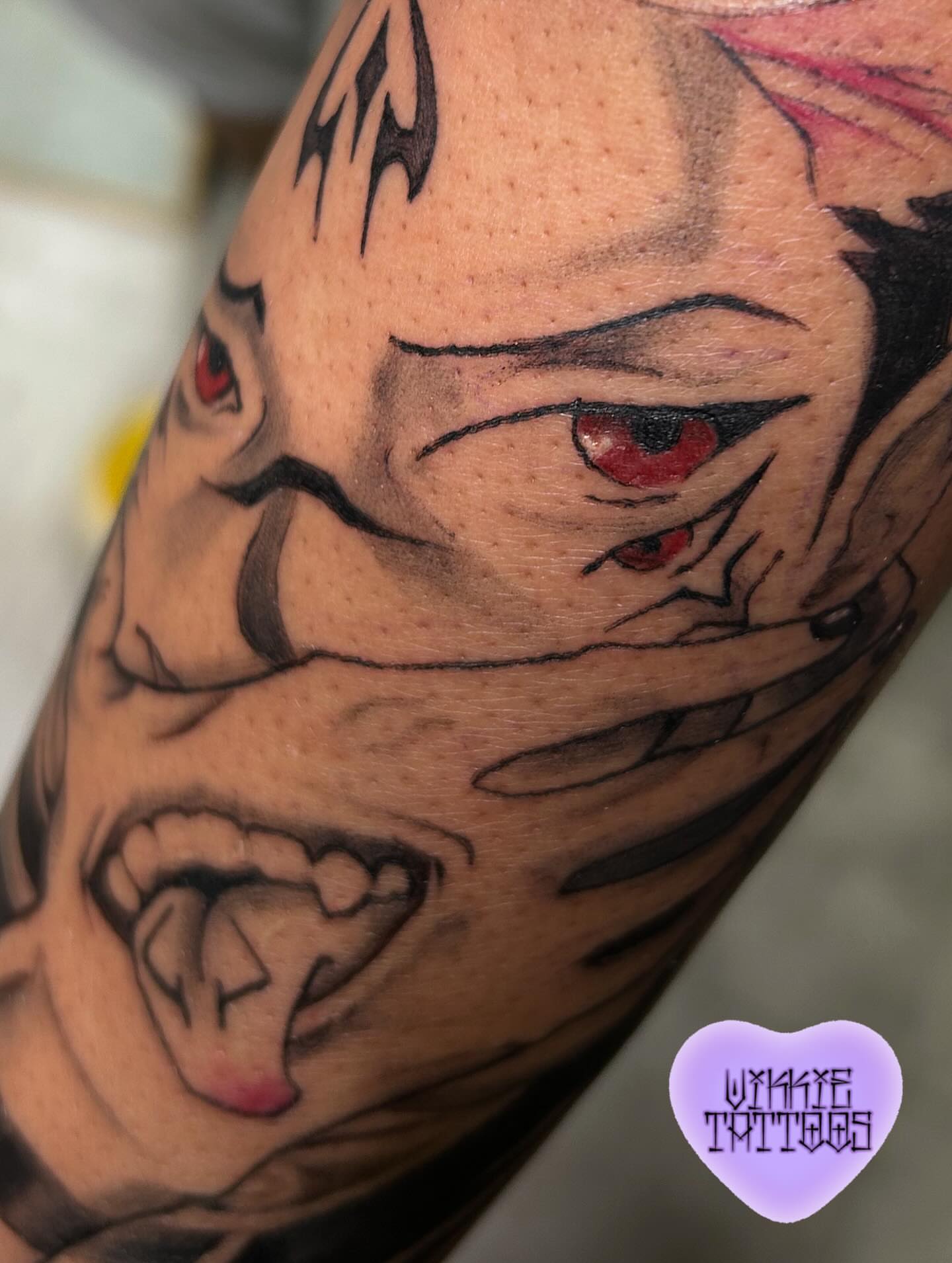 Angry face realism tattoo on the forearm by Victoria Mendez