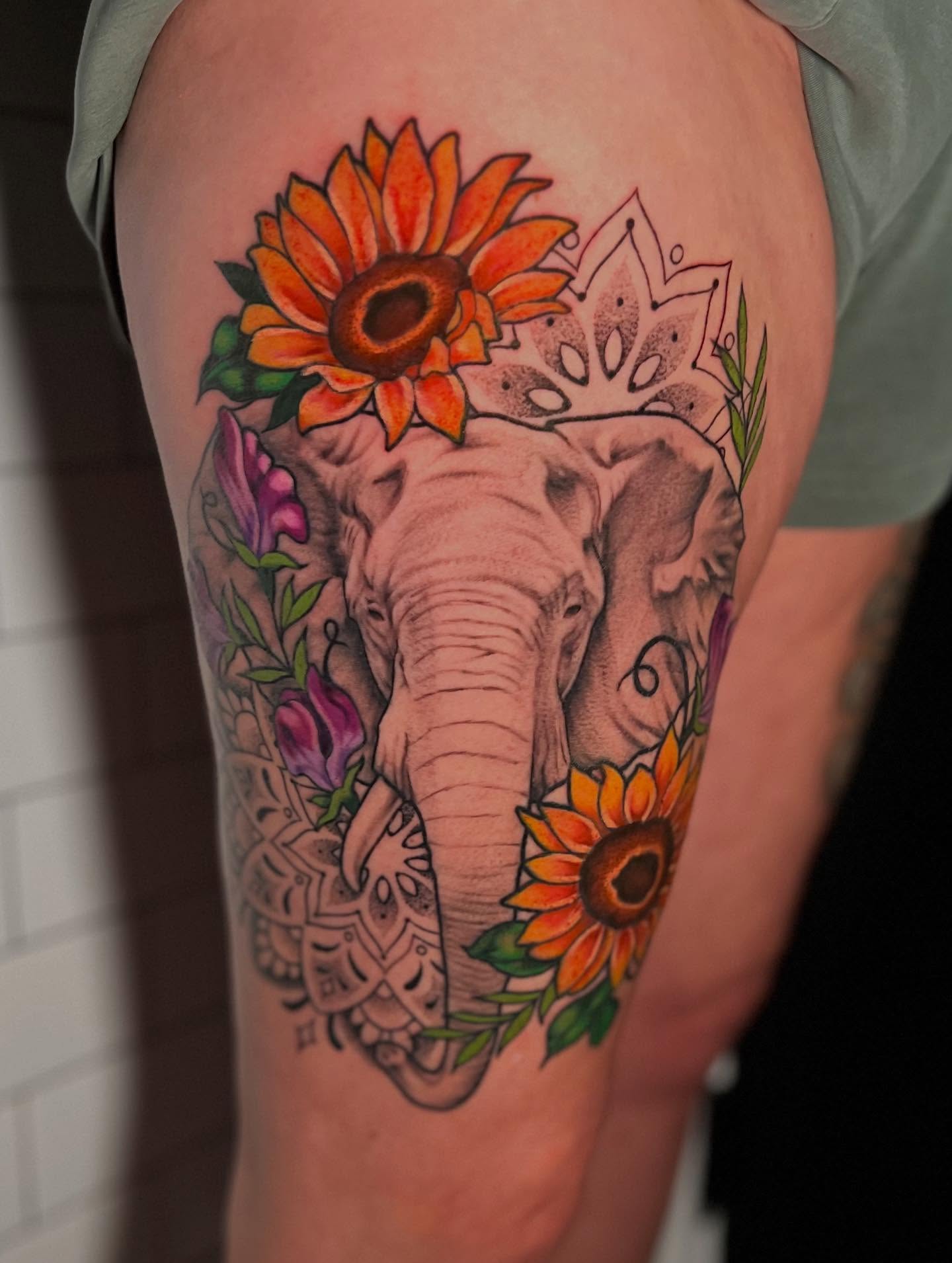 Elephant and sunflowers new school tattoo on the thigh by l y n d s e y r i c k e t t s