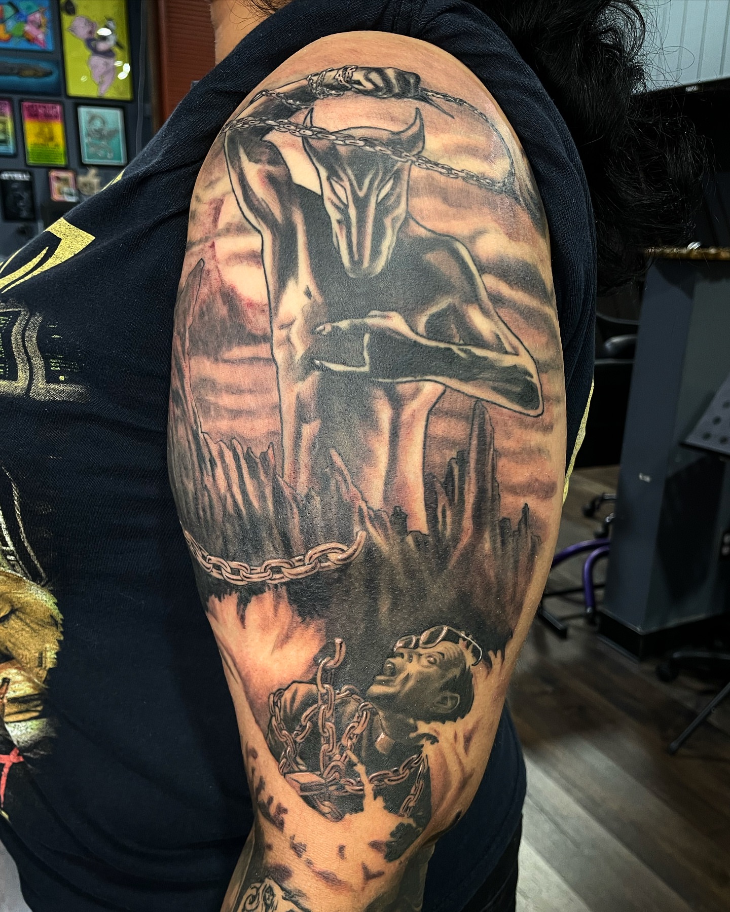 Bull and man realism tattoo on the upper arm by Alex Ortiz