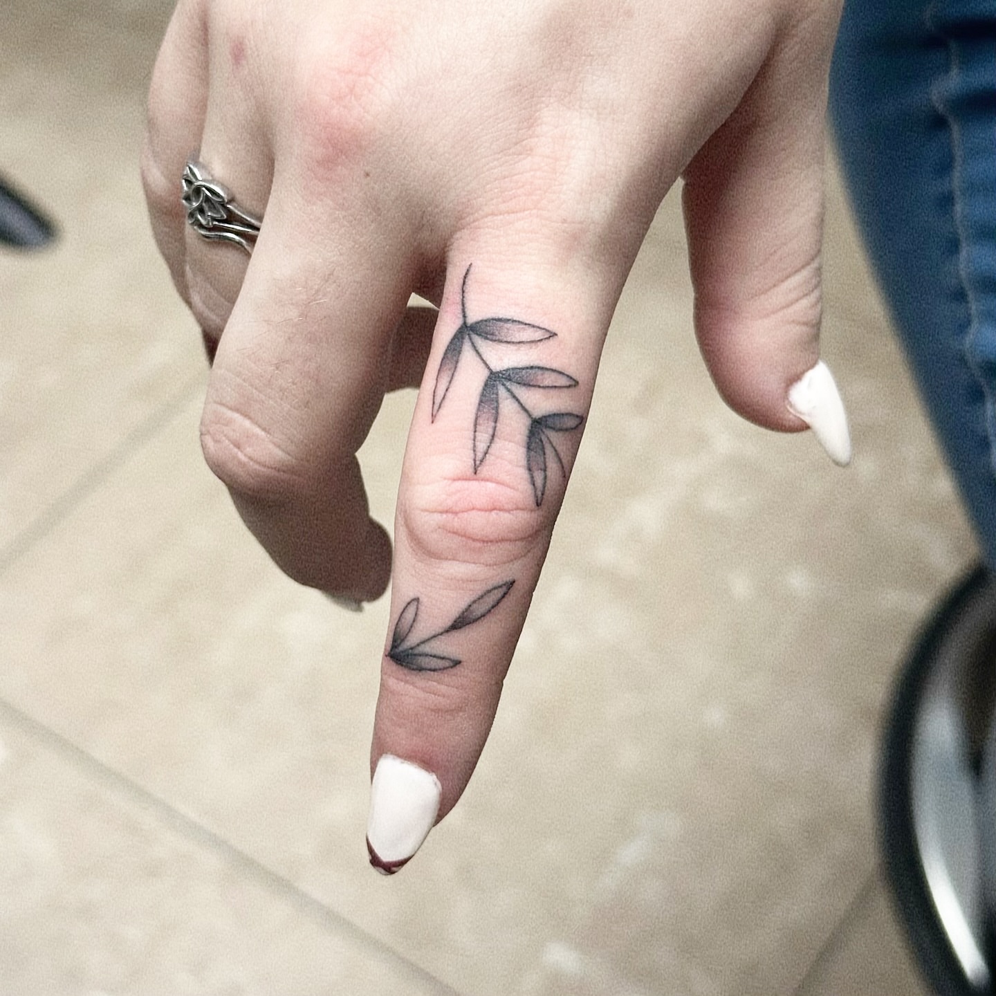 Branch black and grey tattoo on the hand by New York Tattoo Artist