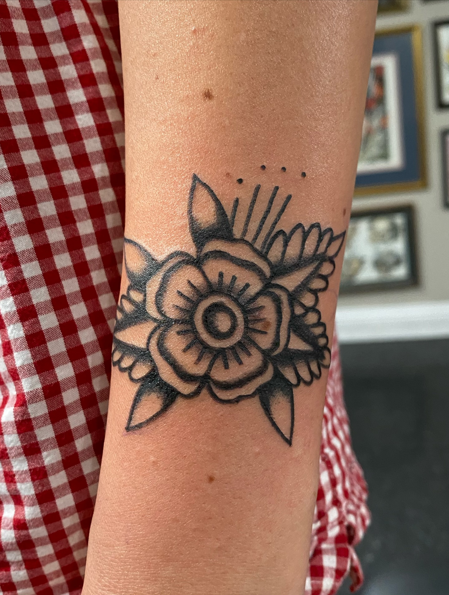 Flower American traditional tattoo on the forearm by Joey Delarosa, San Francisco, California