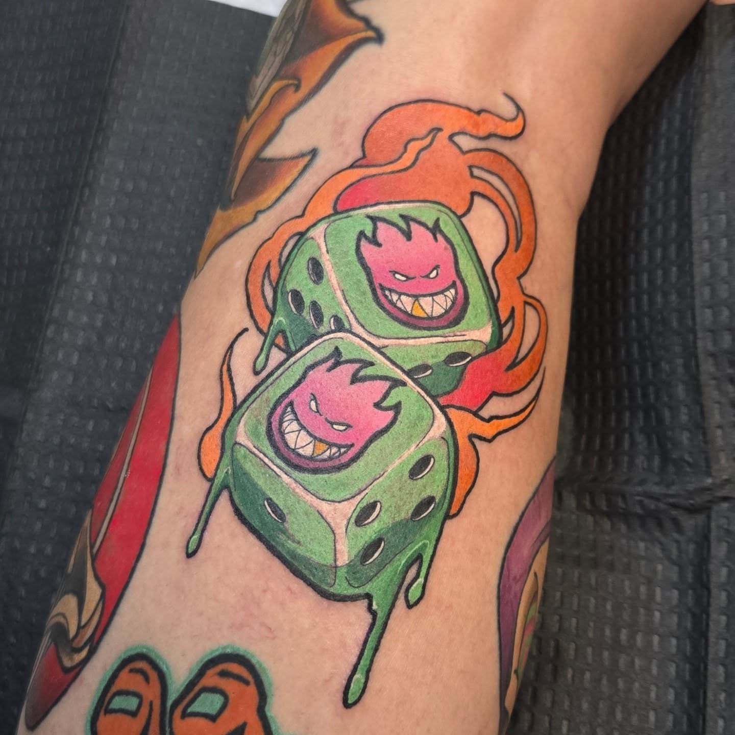 Green dice with flames American traditional tattoo on the forearm by Brian Savage, Gilbert, Arizona