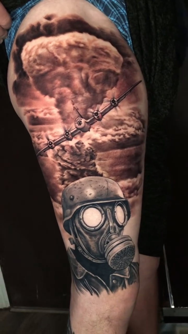 Gas mask and mushroom cloud dark realism tattoo by Oak Adams