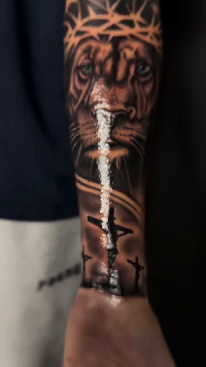 Lion and crown of thorns realism tattoo by Alex Romero