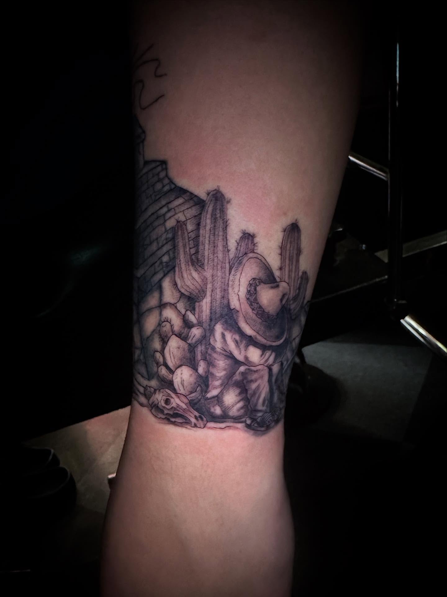 Desert landscape realism tattoo on the forearm by Sierra