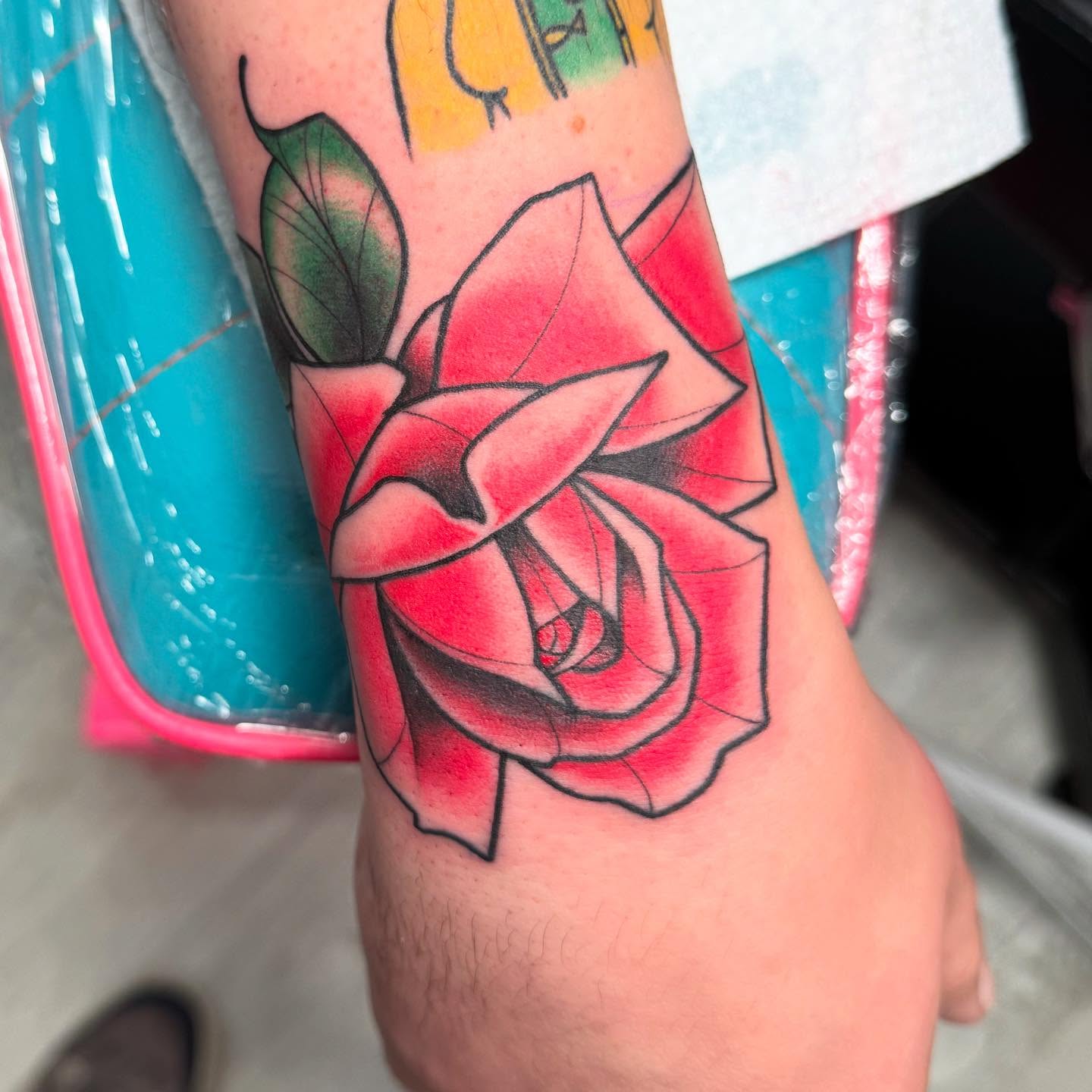 Red rose American traditional tattoo on the forearm by Shelby Raia
