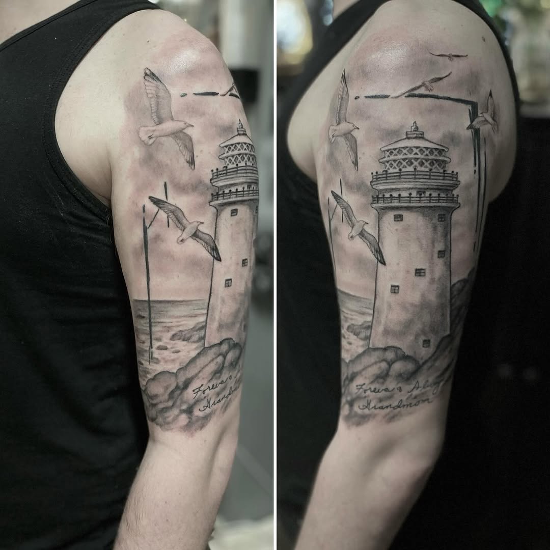 Lighthouse and seagulls tattoo on the forearm by Dana Jones
