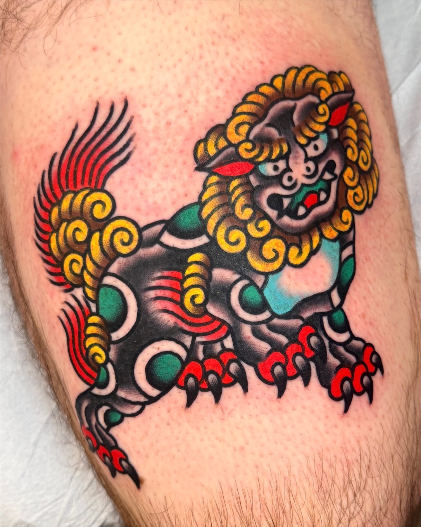Lion American traditional tattoo on the thigh by Cullen Bleser Quinn
