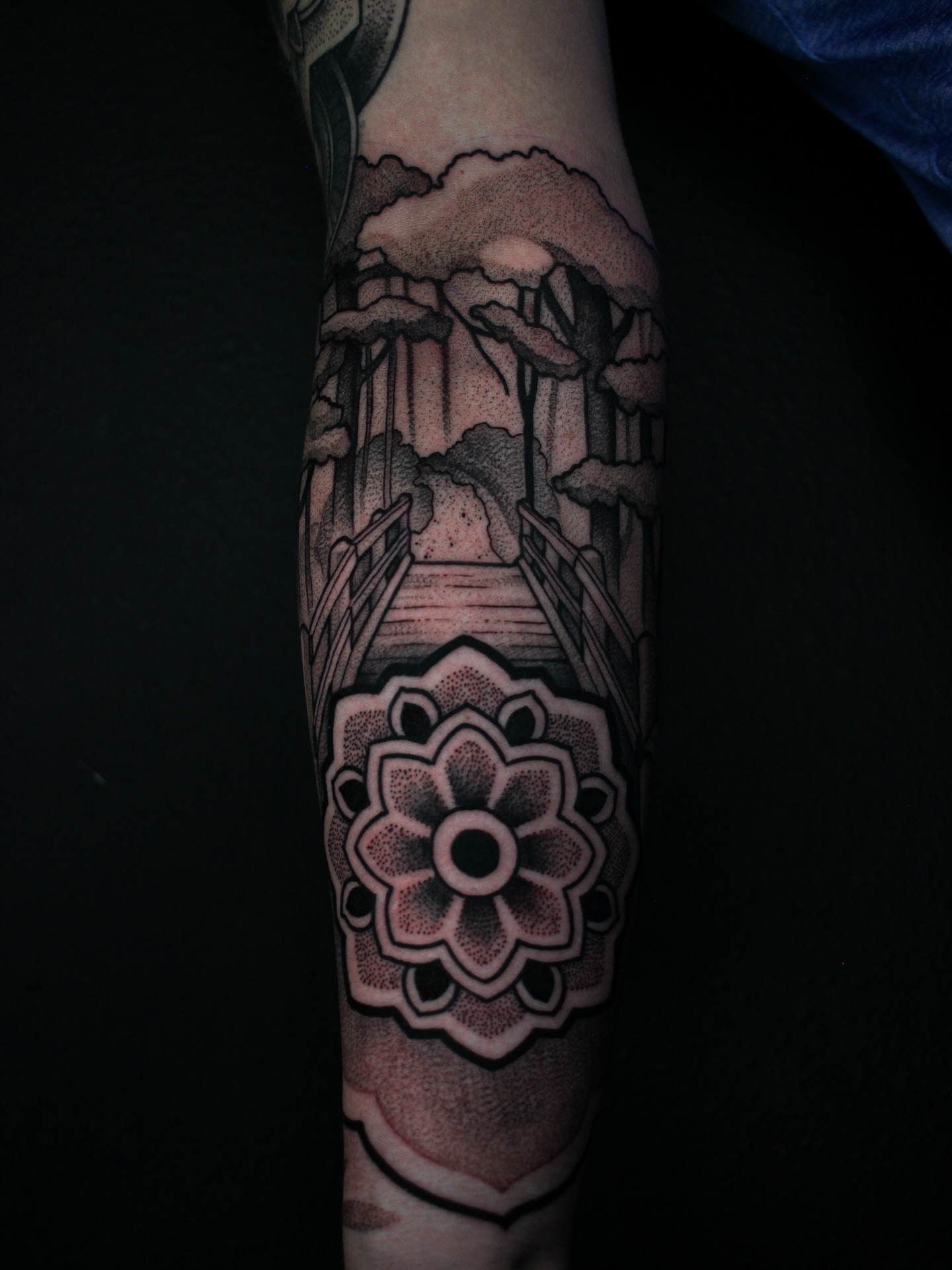 Lotus flower geometric tattoo on the forearm by Chris Dobransky