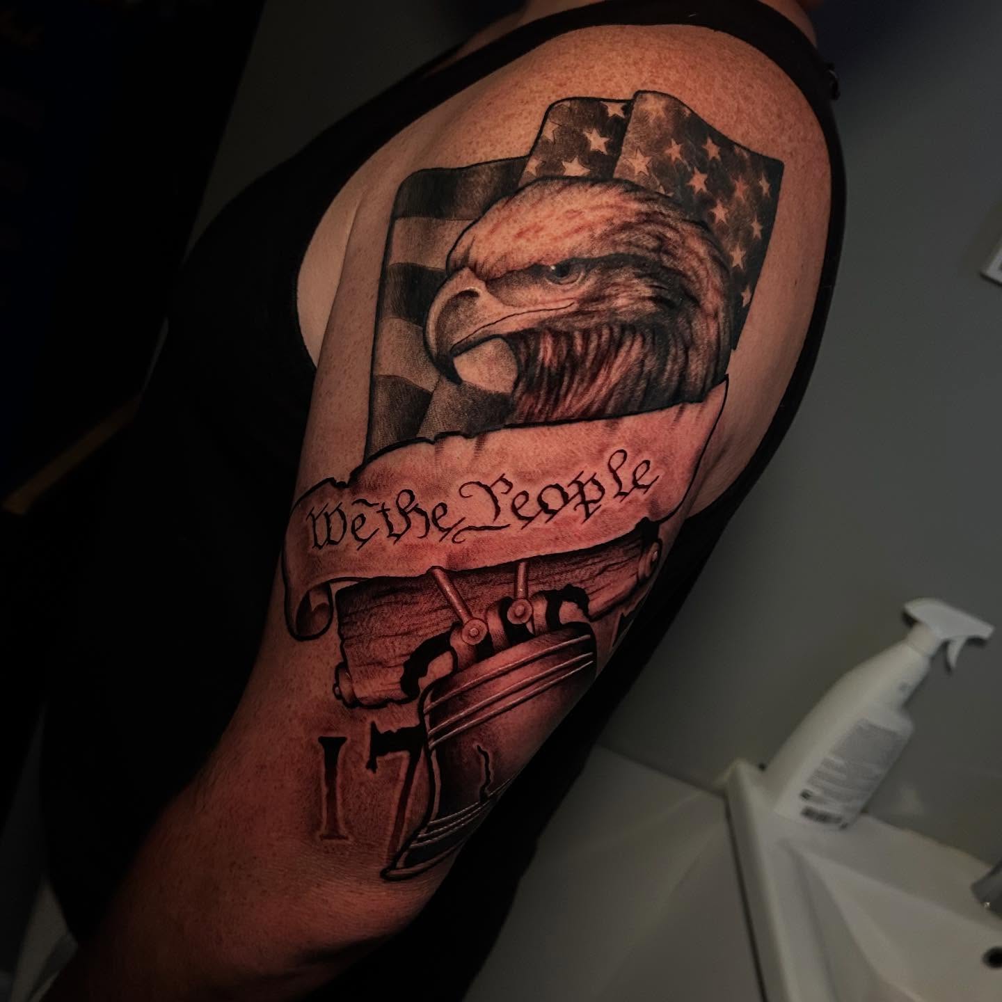 American flag eagle American traditional tattoo on the thigh by Adrian Michigan Tattoo Artist