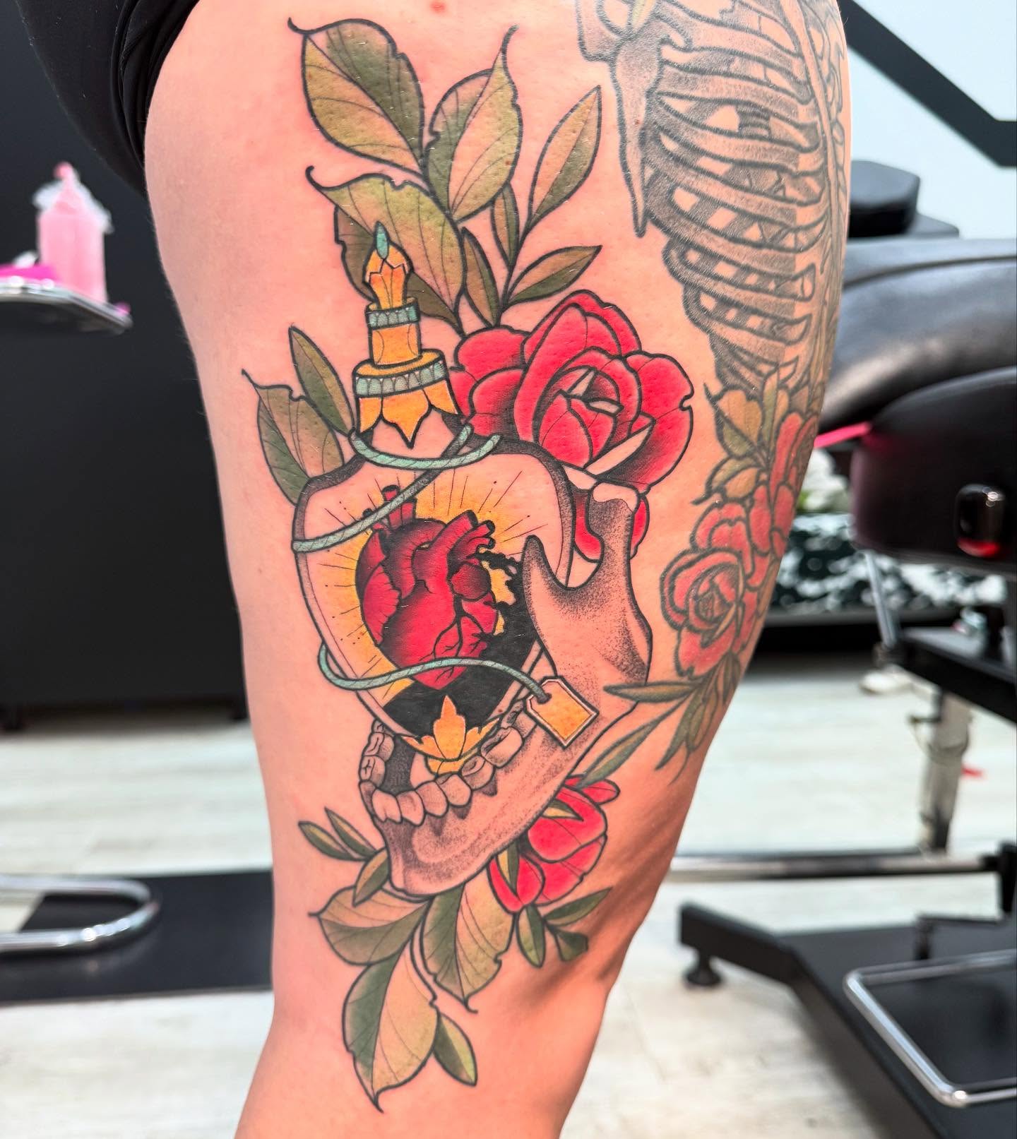 Heart and skull American traditional tattoo on the thigh by Shelby Raia