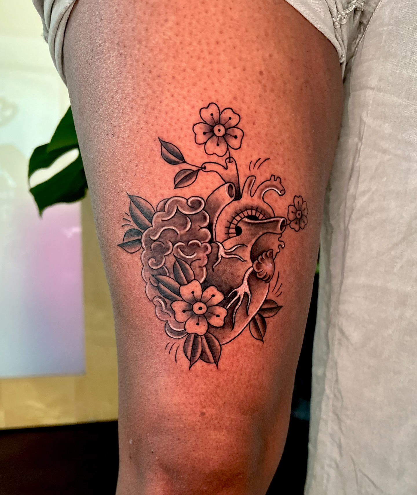 Heart with flowers American traditional tattoo on the thigh by Joi Bailey, Denton, Texas