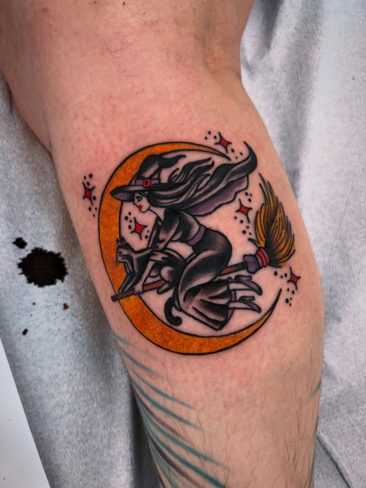 Witch flying on broomstick American traditional tattoo on the thigh by Shannon Pagliarini