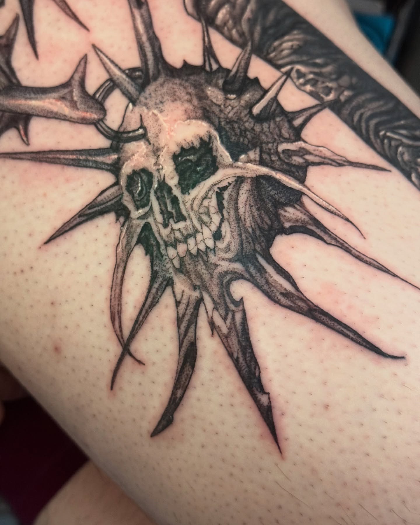 Skull with spikes dark realism tattoo on the forearm by Erick Mendivil