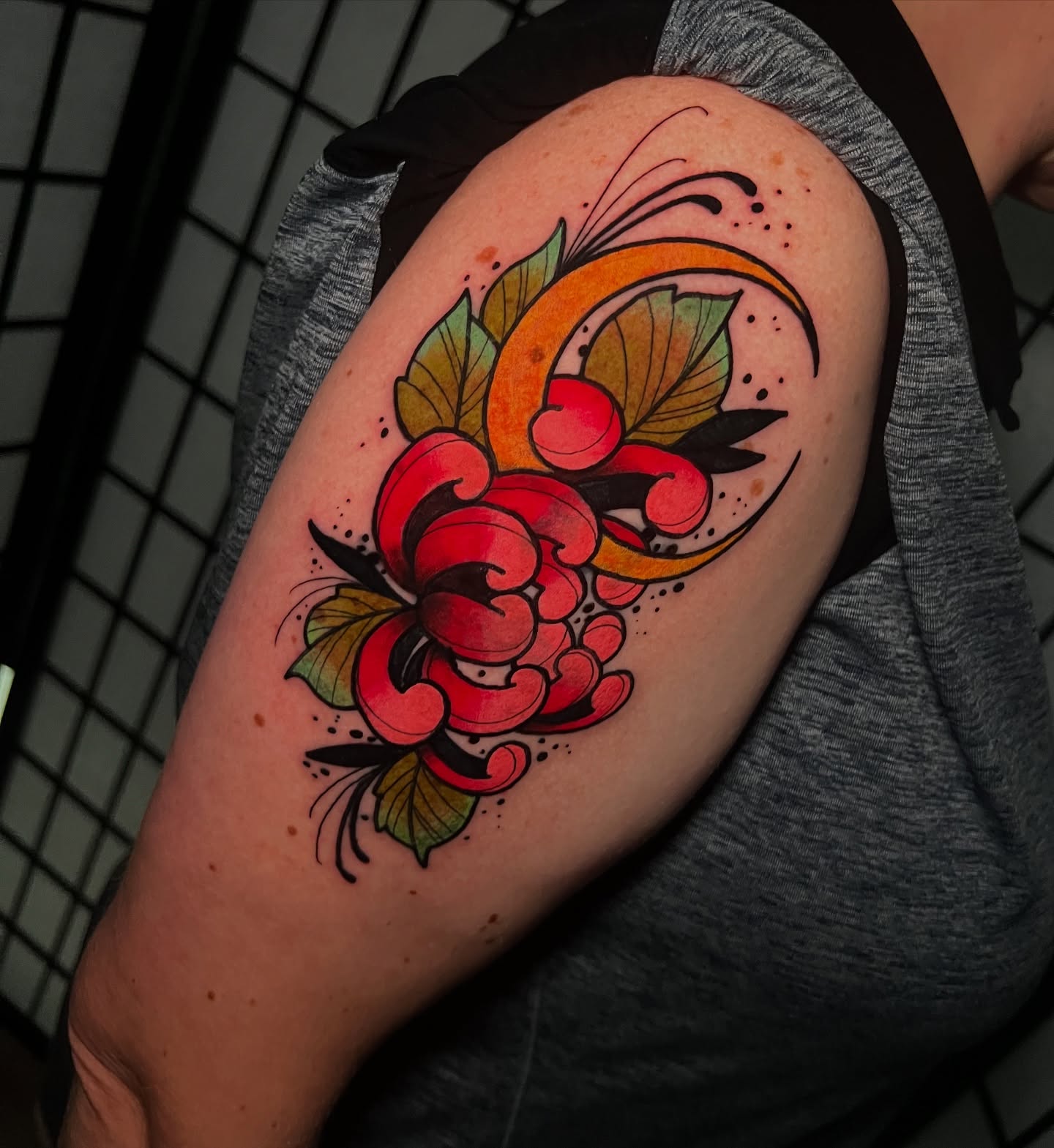 Floral bouquet American traditional tattoo on the shoulder by Tattoo Artist
