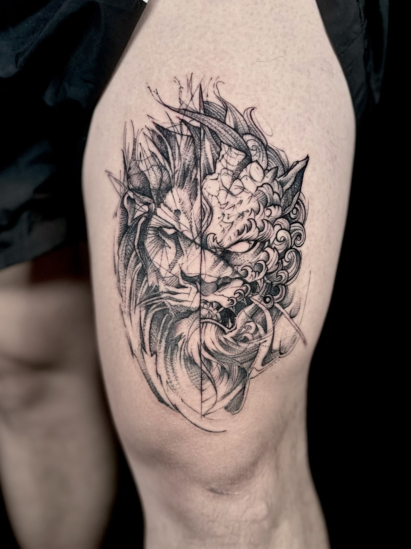 Lion black and grey tattoo on the thigh by Abi