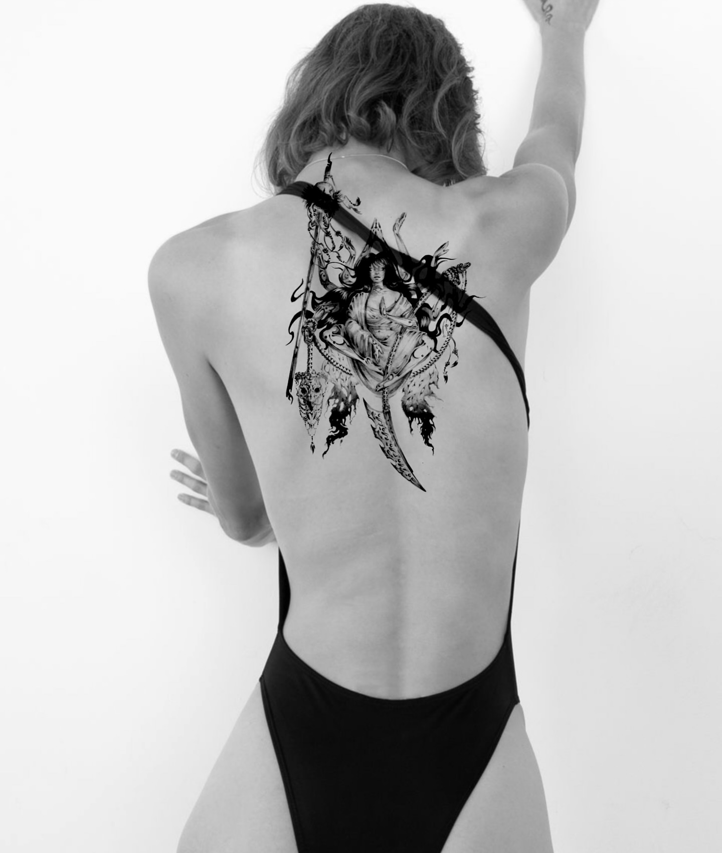 Woman with sword illustrative tattoo on the back by Grace Zarmina Hessam