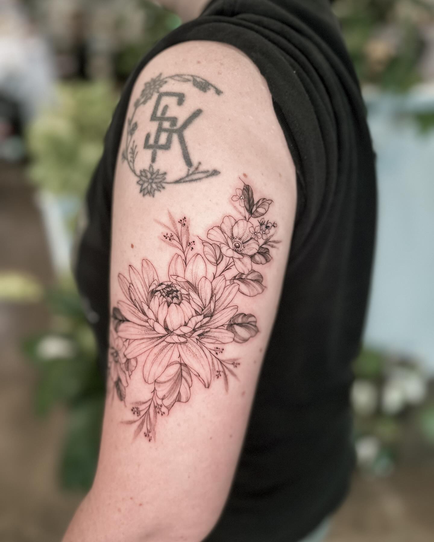 Floral bouquet black and grey tattoo on the forearm by 🌙nadia Renee