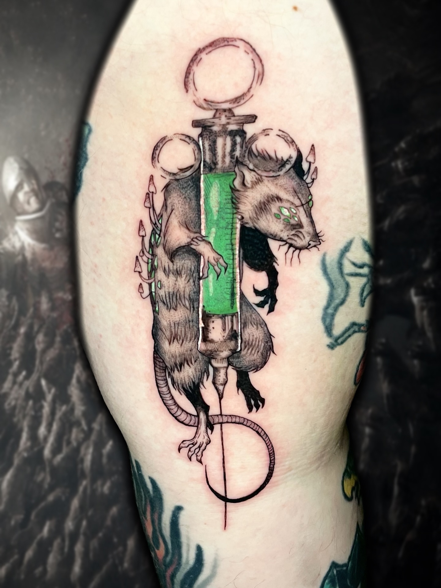 Rat and syringe realism tattoo on the forearm by Shontel Fowler