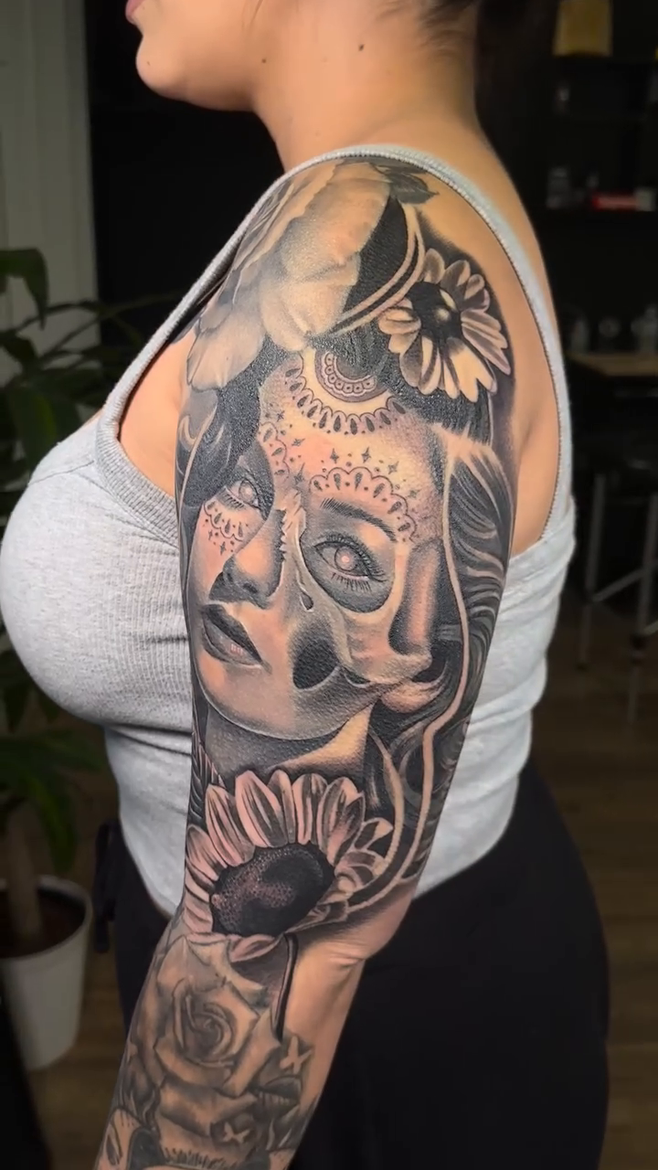 Woman with flowers realism tattoo by DH Tattooing