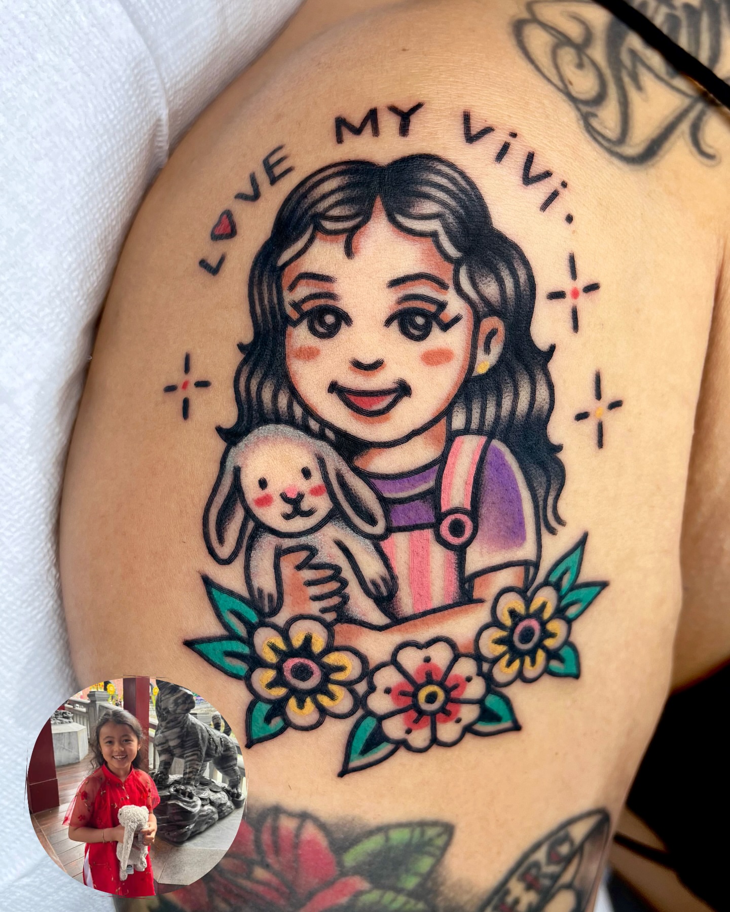 Child with rabbit American traditional tattoo on the shoulder by 올드스쿨타투 레드립