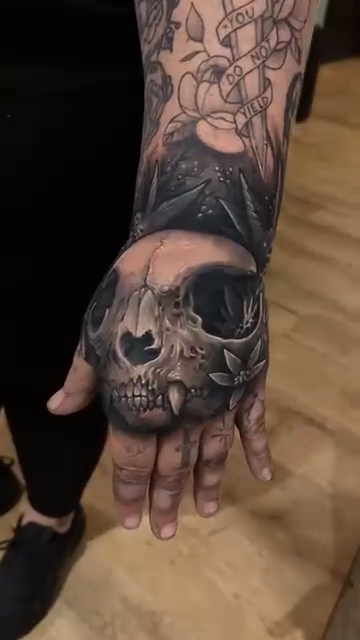Skull with flowers realism tattoo by π΅ππππ π―πππππππ