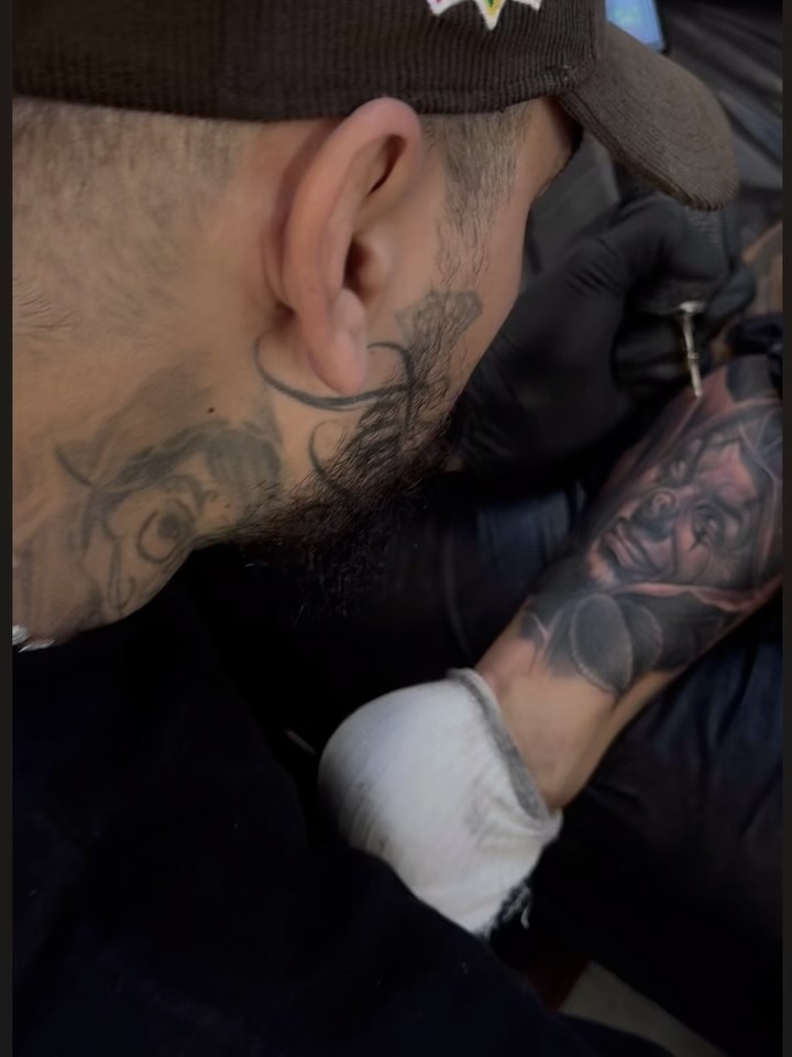 Beard black and grey tattoo on the upper arm by Dillinger, Ventura, California
