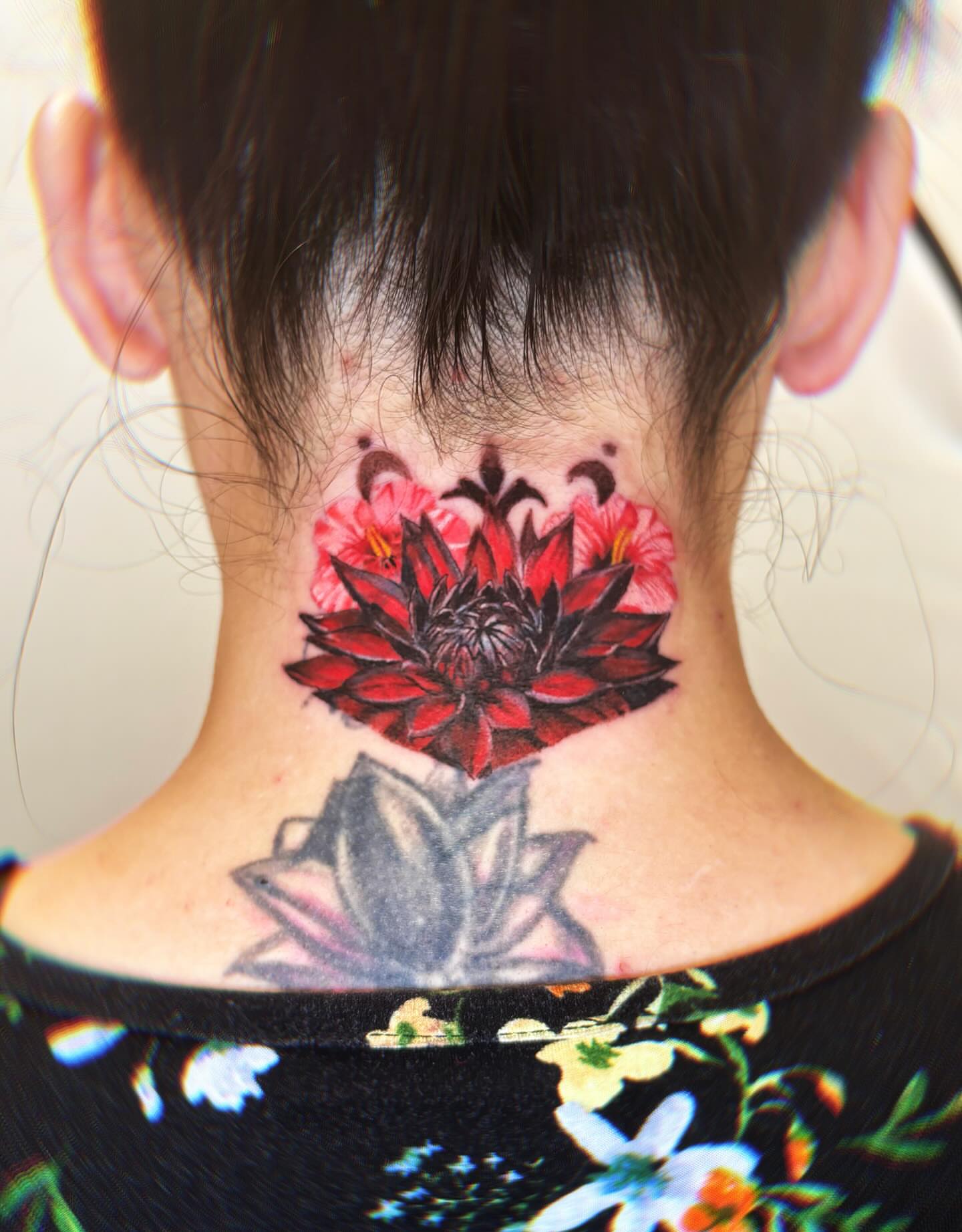 Lotus flower realism tattoo on the neck by Yu Chen