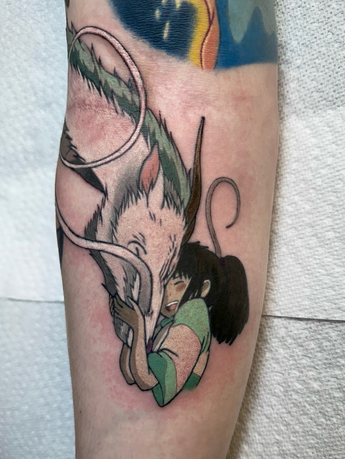 Monkey and girl anime tattoo on the forearm by Savannah Compton
