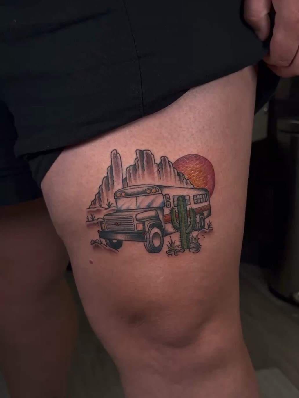 Bus and desert landscape American traditional tattoo on the thigh by πππͺ‘