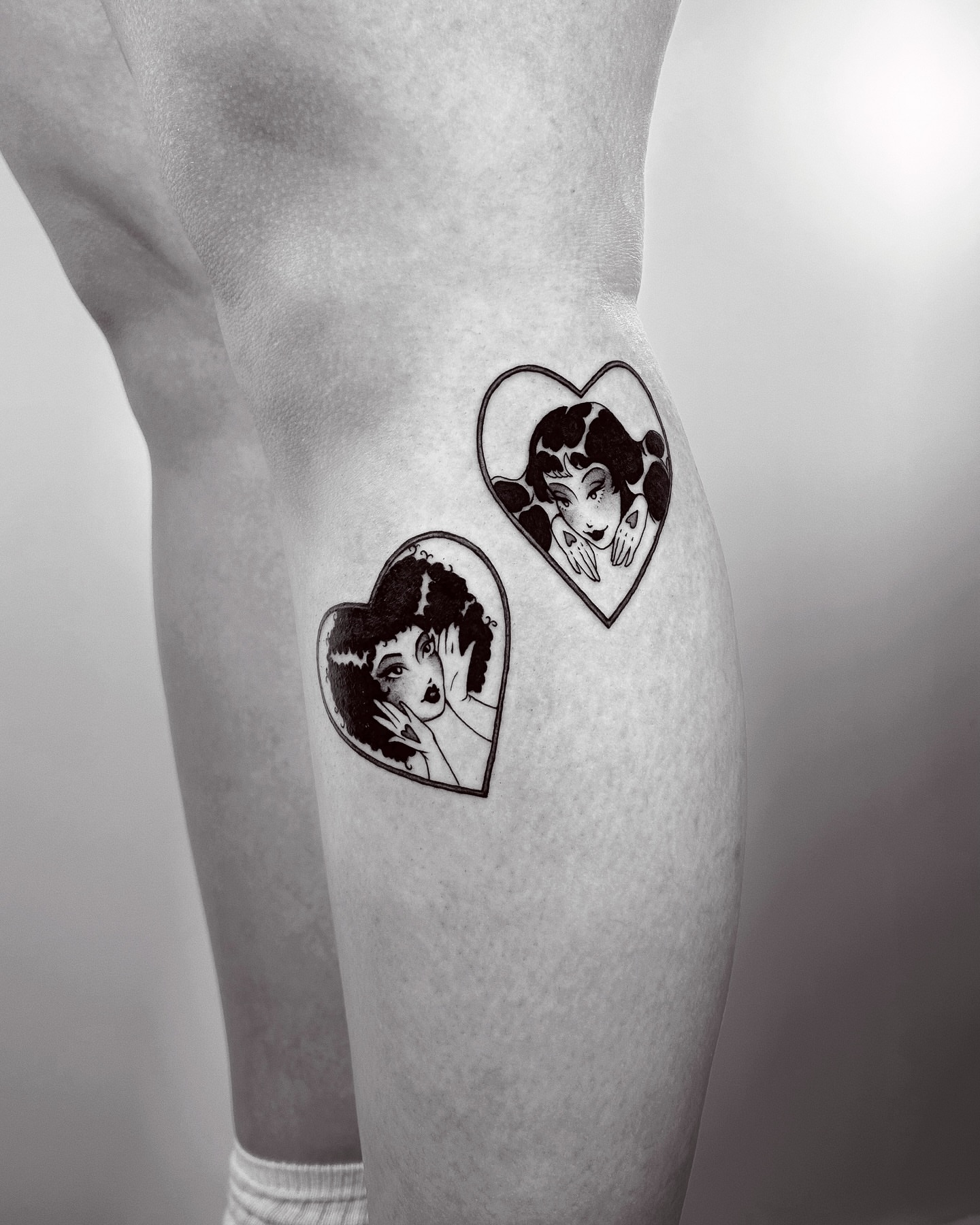 Heart with woman black and grey tattoo on the thigh by Montana Chambers