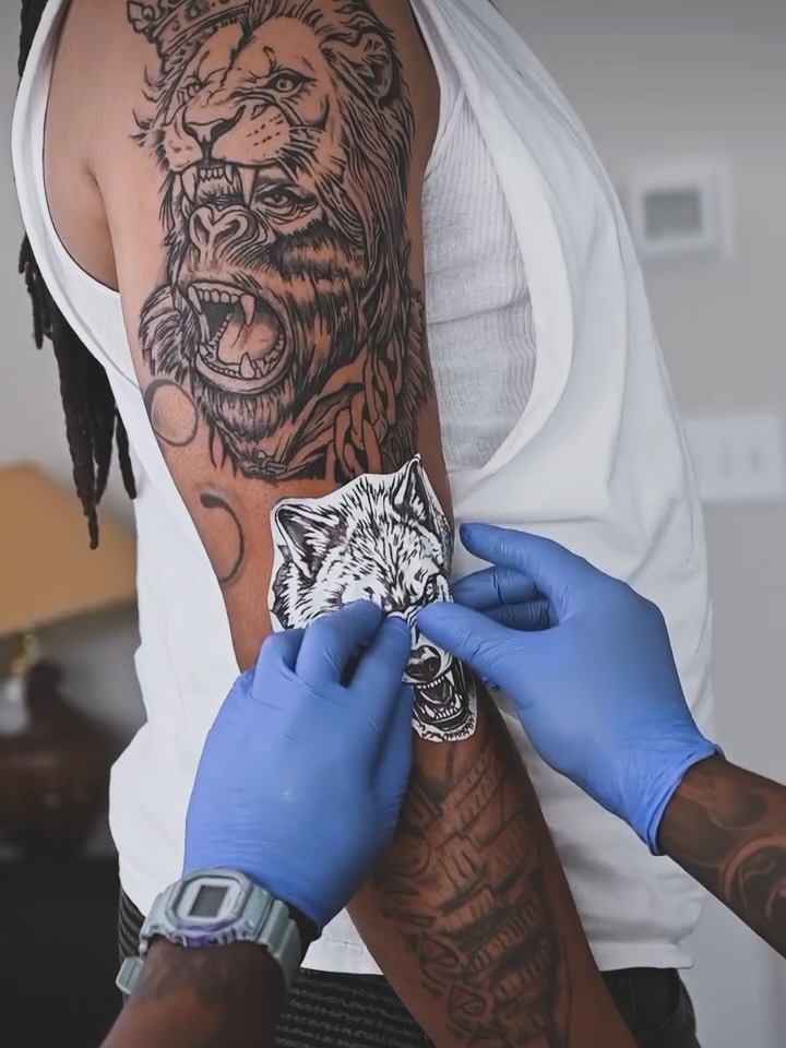 Lion black and grey tattoo on the upper arm by Jihaad staley π¦, Charlotte, North Carolina