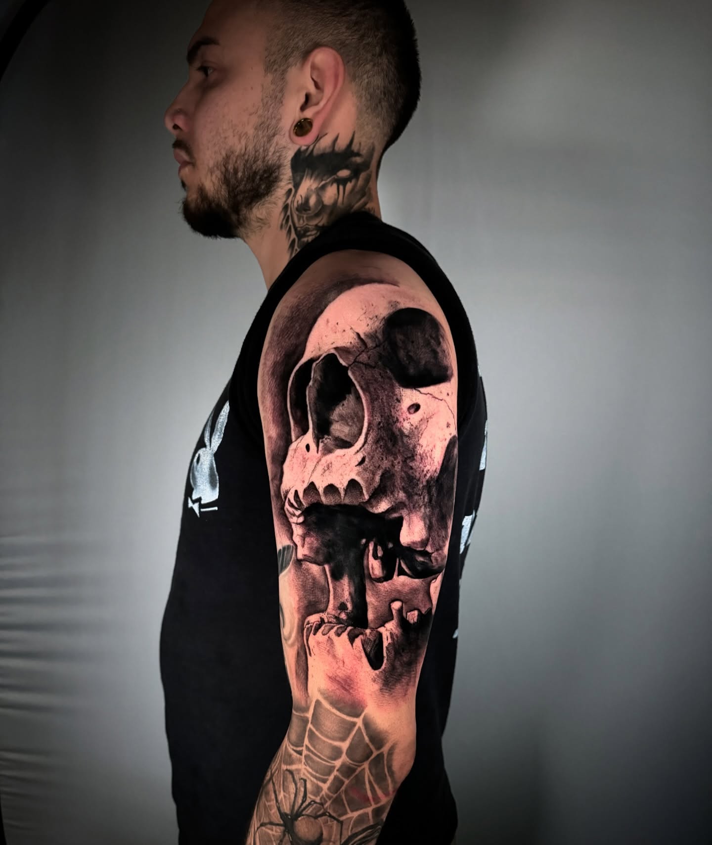 Skull realism tattoo on the upper arm by Georgios Papadopoulos Tattoo Artist Los