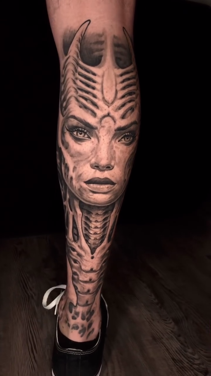 Biomechanical face and machinery realism tattoo by Oak Adams