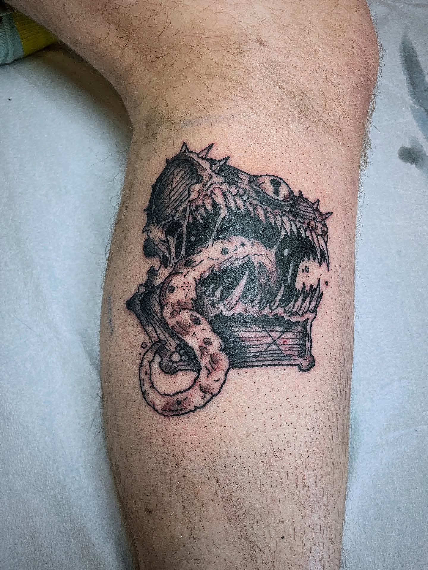 Monster black and grey tattoo on the thigh by Cam TallBoy SLC Tattoo Artist, Salt Lake City, Utah