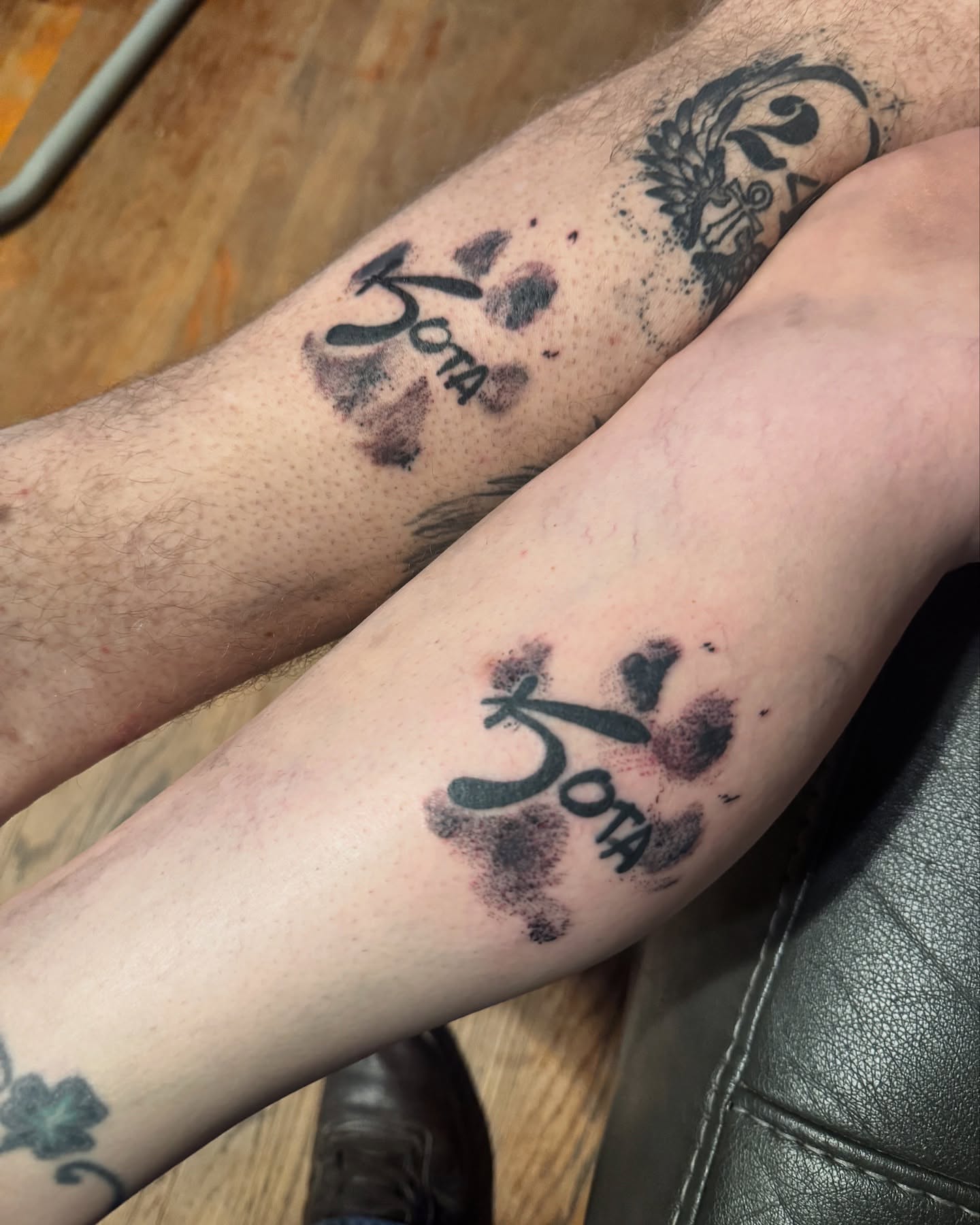 Paw print with name dotwork tattoo on the forearm by Matthew Clanin