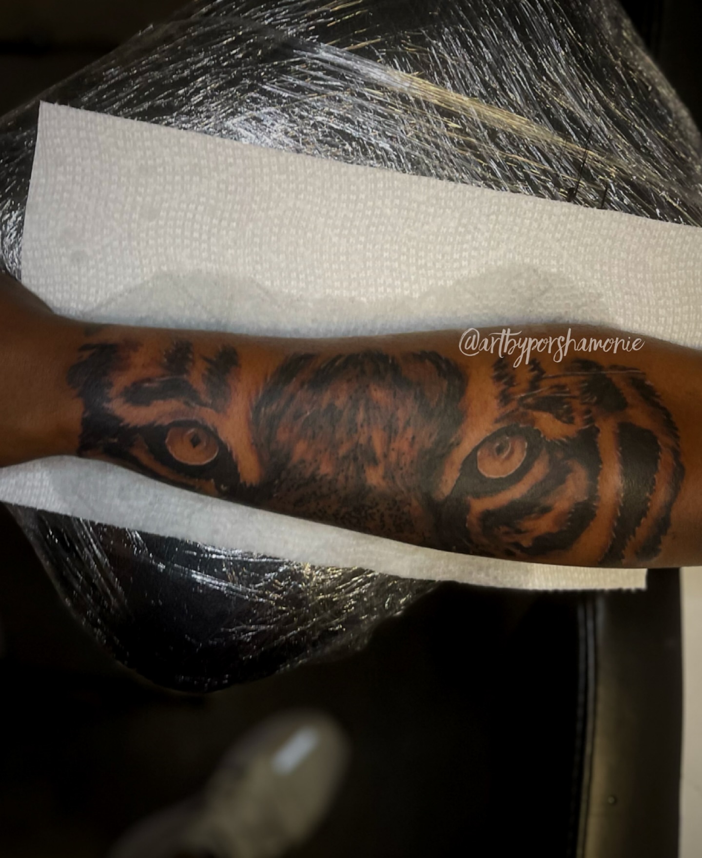 Tiger eyes realism tattoo on the forearm by Porshamonie' THE Tattoo ARTIST