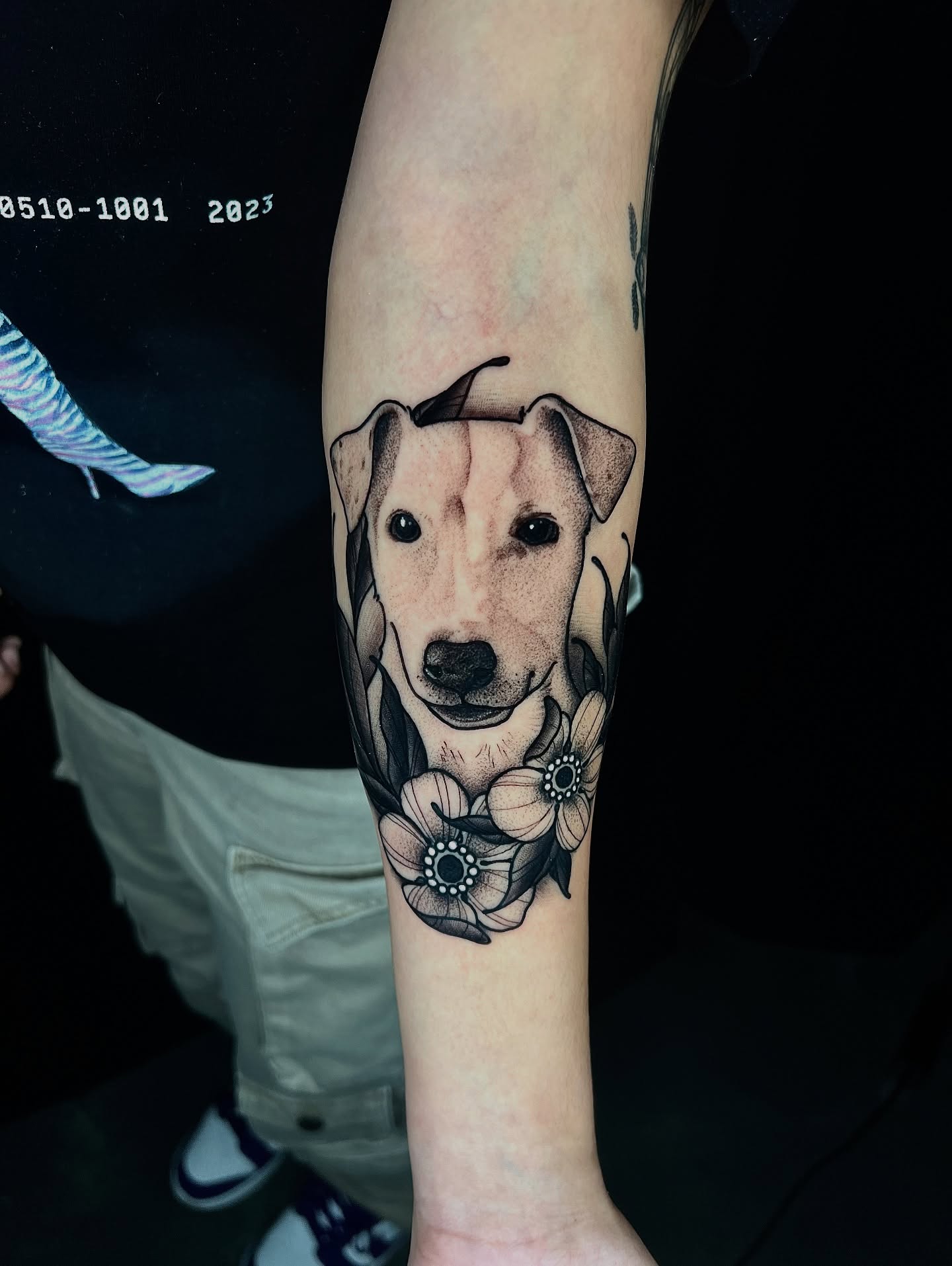 Dog portrait realism tattoo on the forearm by Pam Sanders