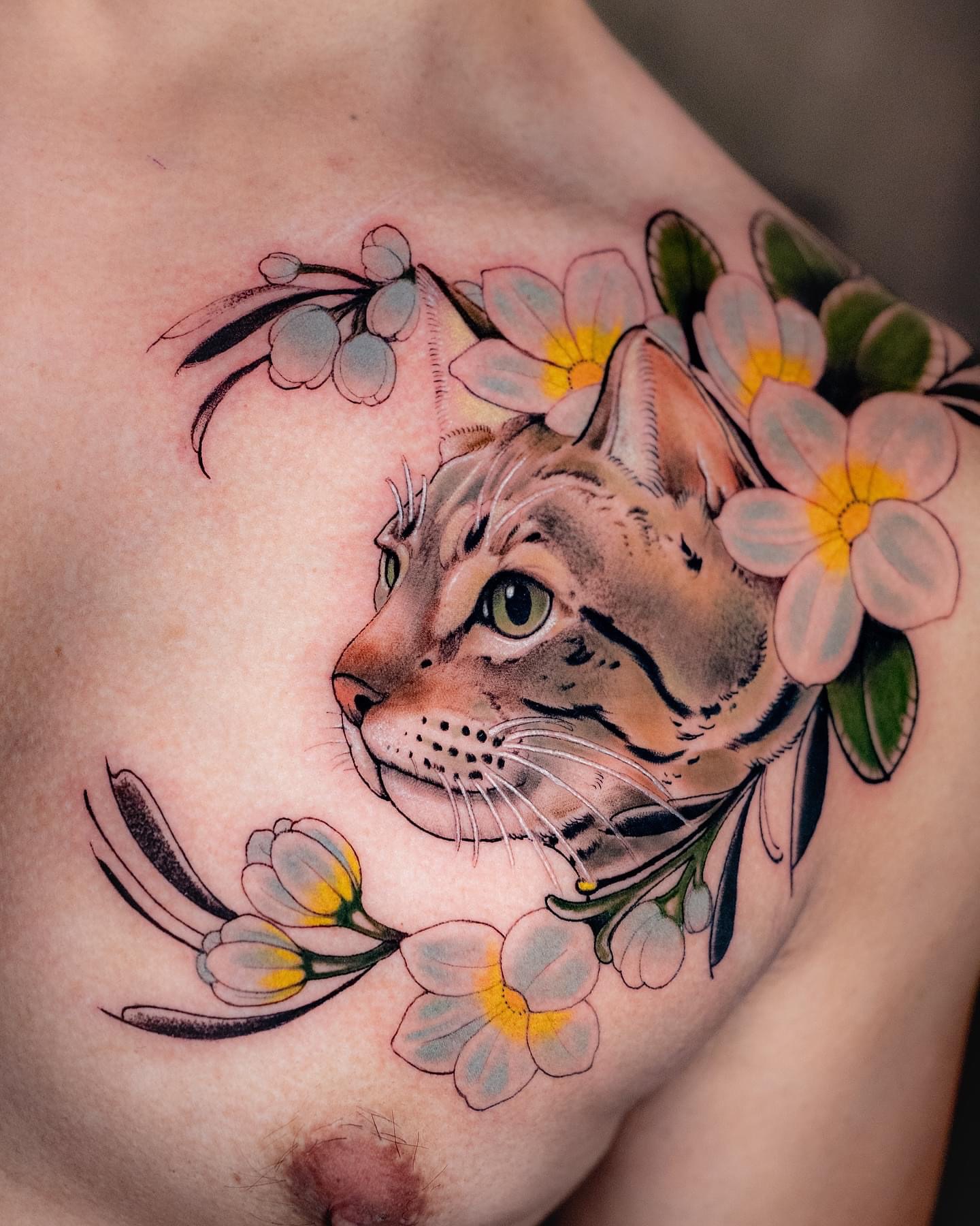 Cat with flowers realism tattoo on the chest by Andres Acevedo, Denver, Colorado