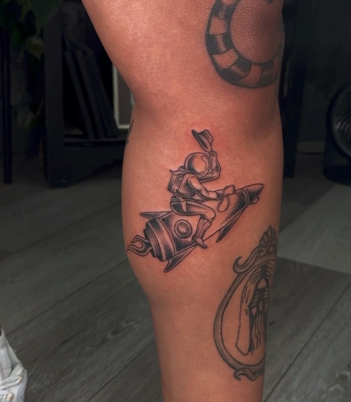 Astronaut on rocket black and grey tattoo on the thigh by πππͺ‘