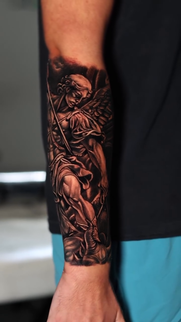 Angel with sword and shield realism tattoo by Insight Ink Tattoo