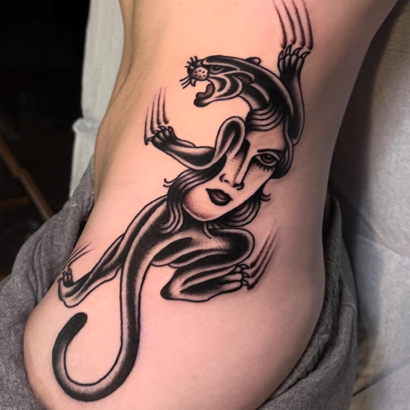 Woman with panther American traditional tattoo by Julia Louise