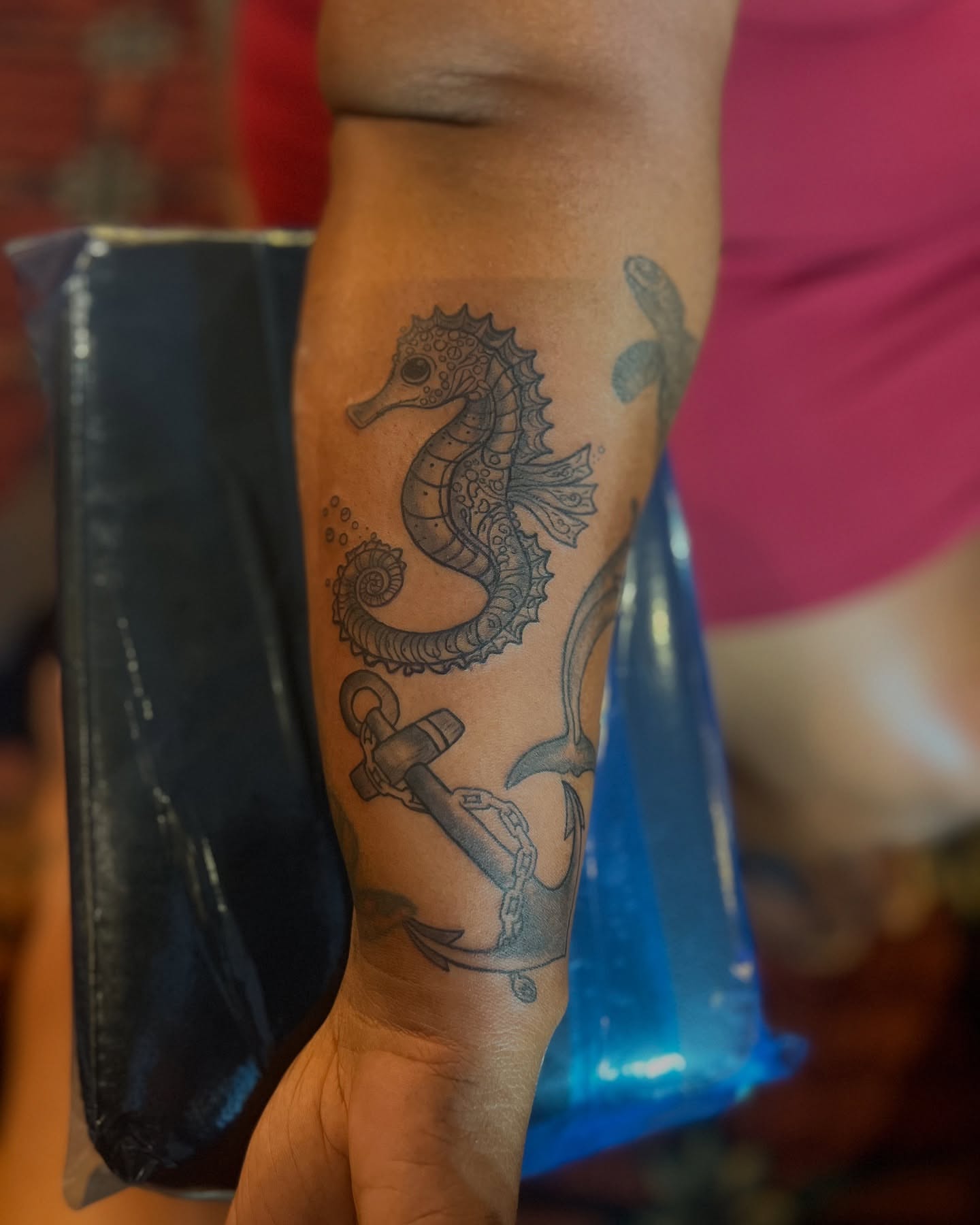 Seahorse and anchor black and grey tattoo on the forearm by CandiCoatedInk