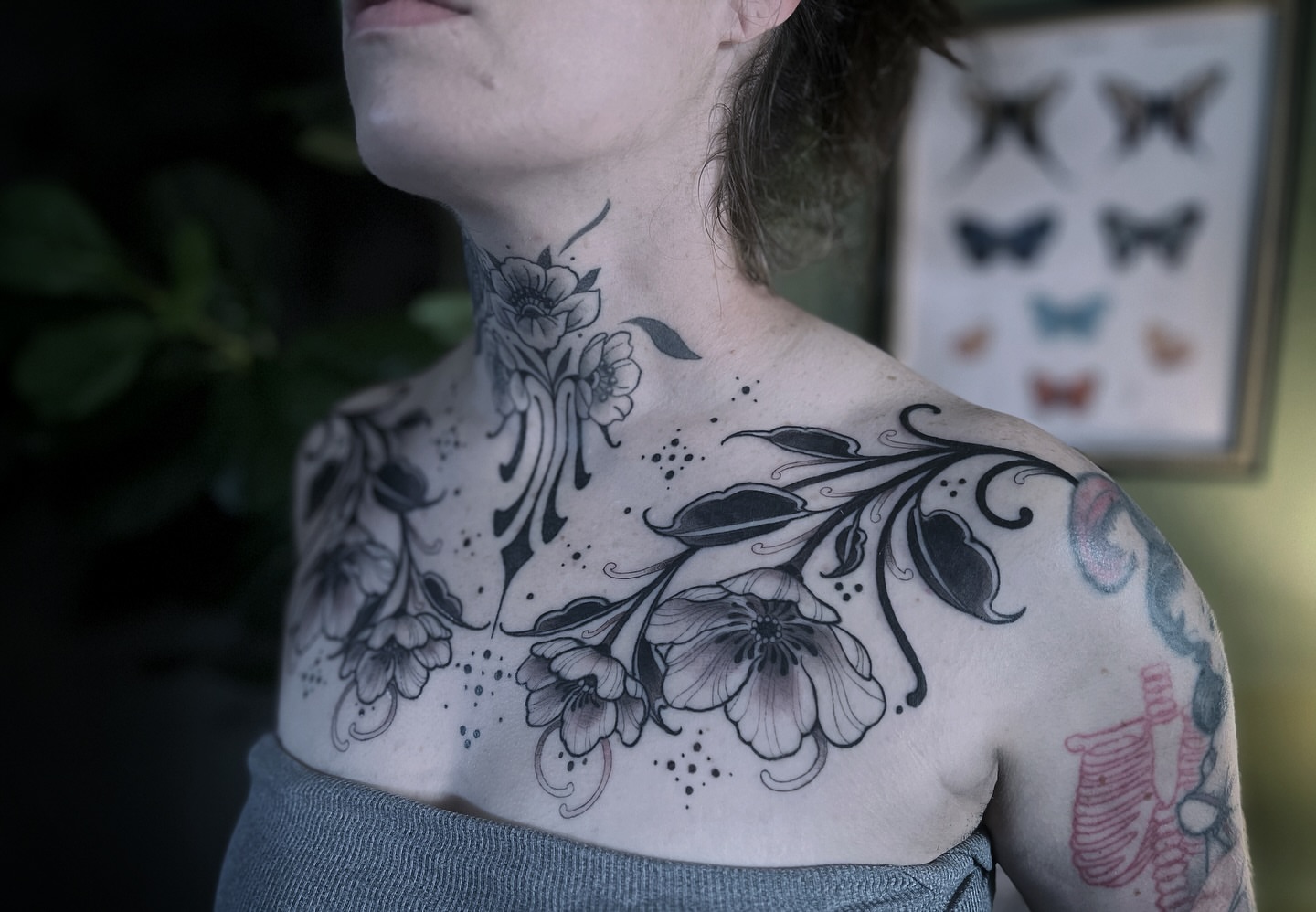 Floral black and grey tattoo on the chest by sam cedar geller 🐝