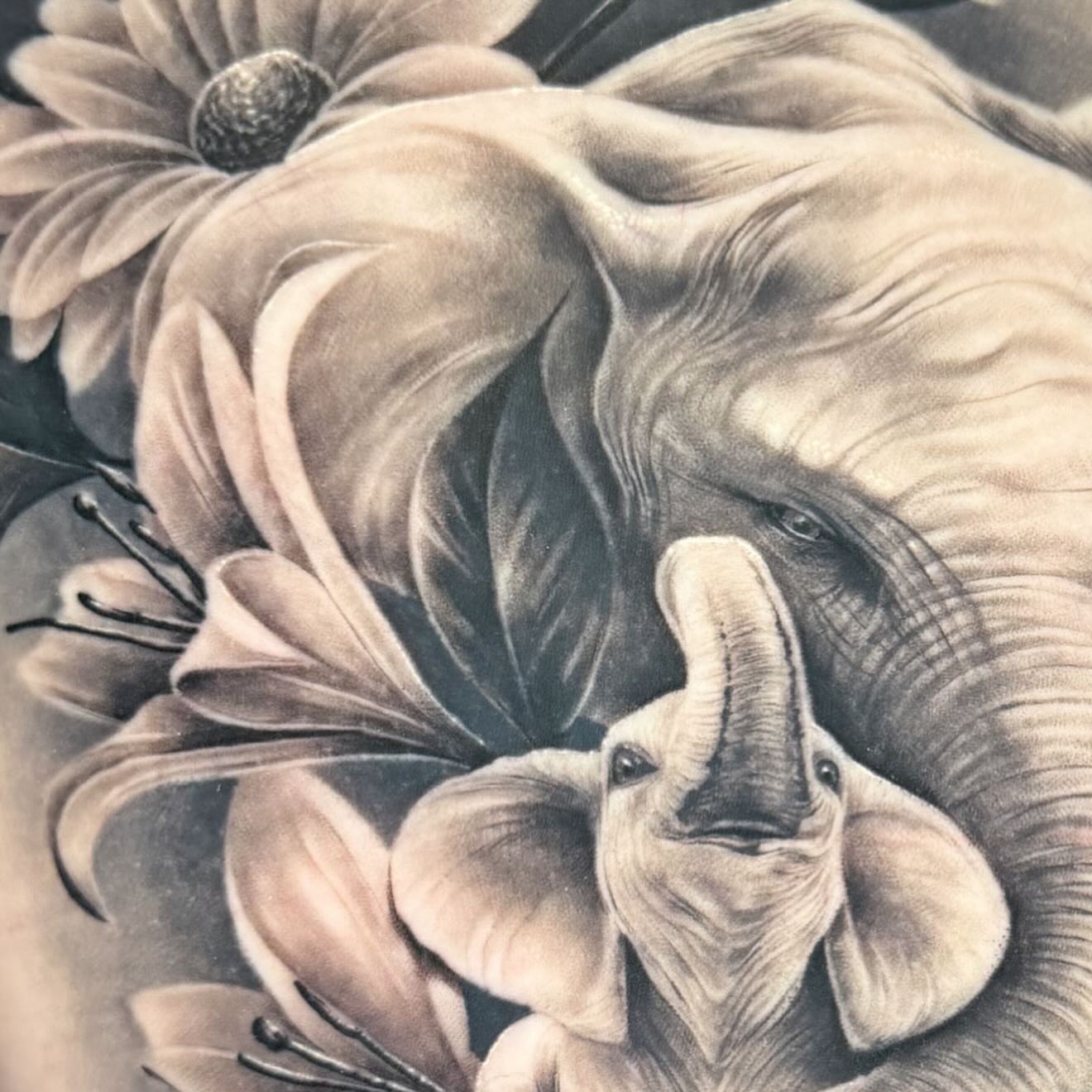 Elephant and flowers realism tattoo by Keith (KAM) Miller