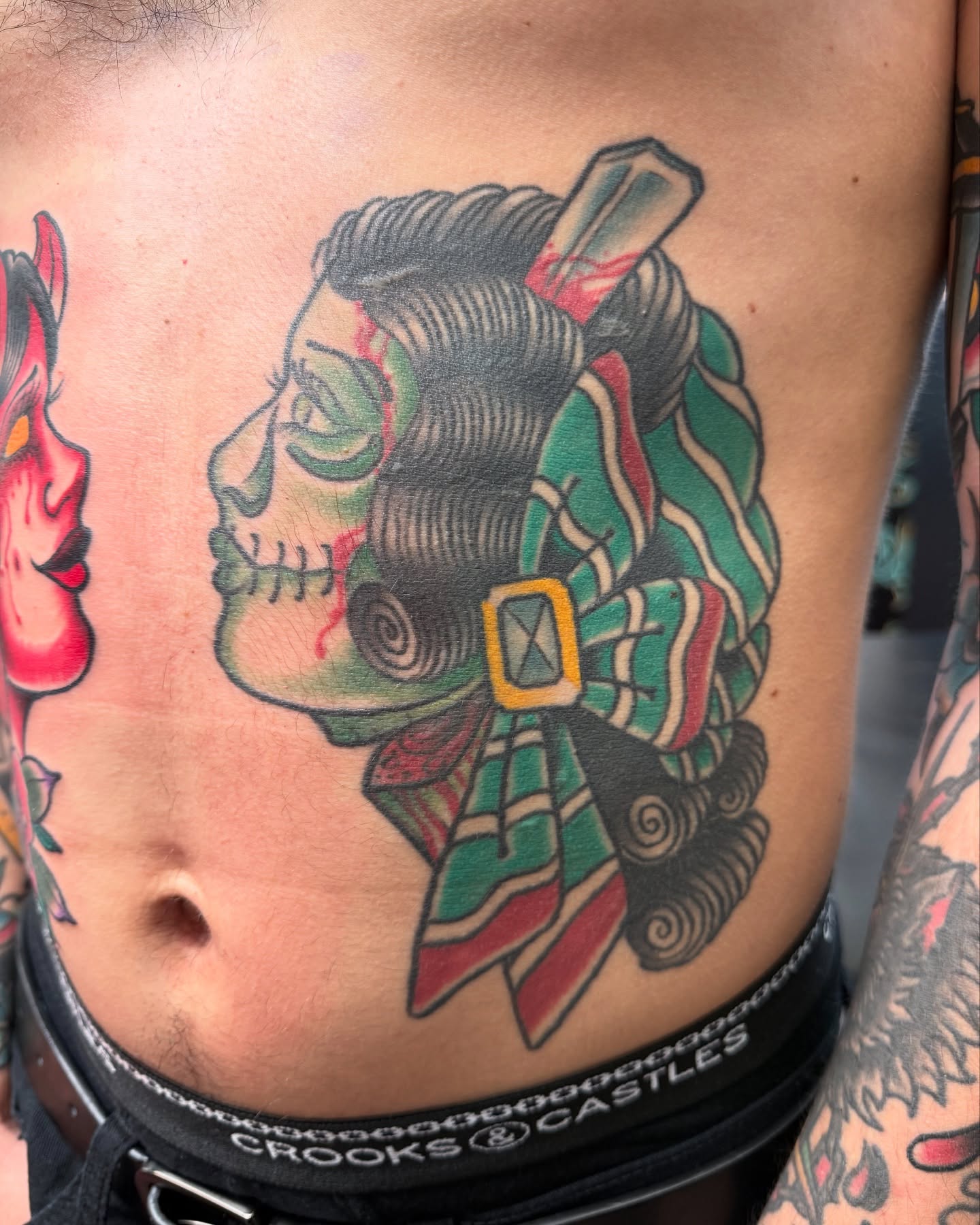 Geisha skull American traditional tattoo on the ribs by DemianThompson